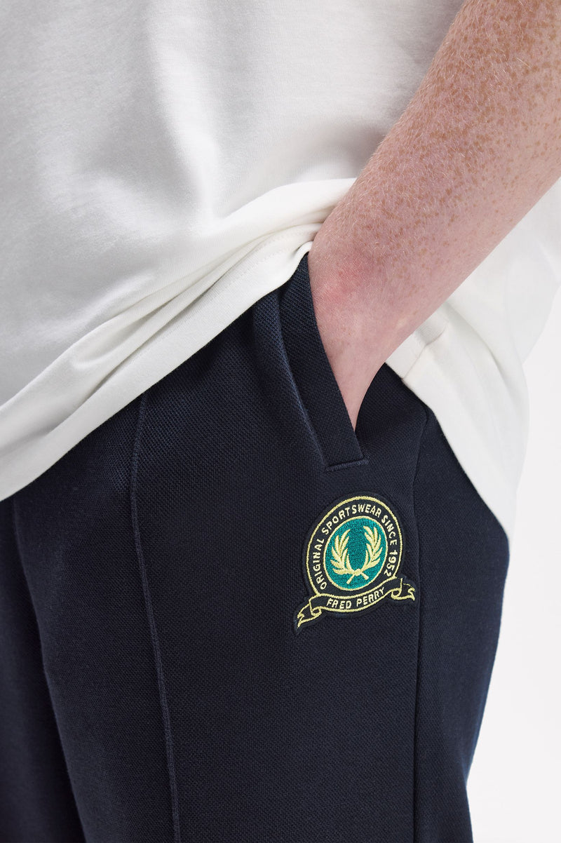 TENNIS BADGE TRACK PANT